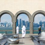 man in white robe standing near statue during daytime